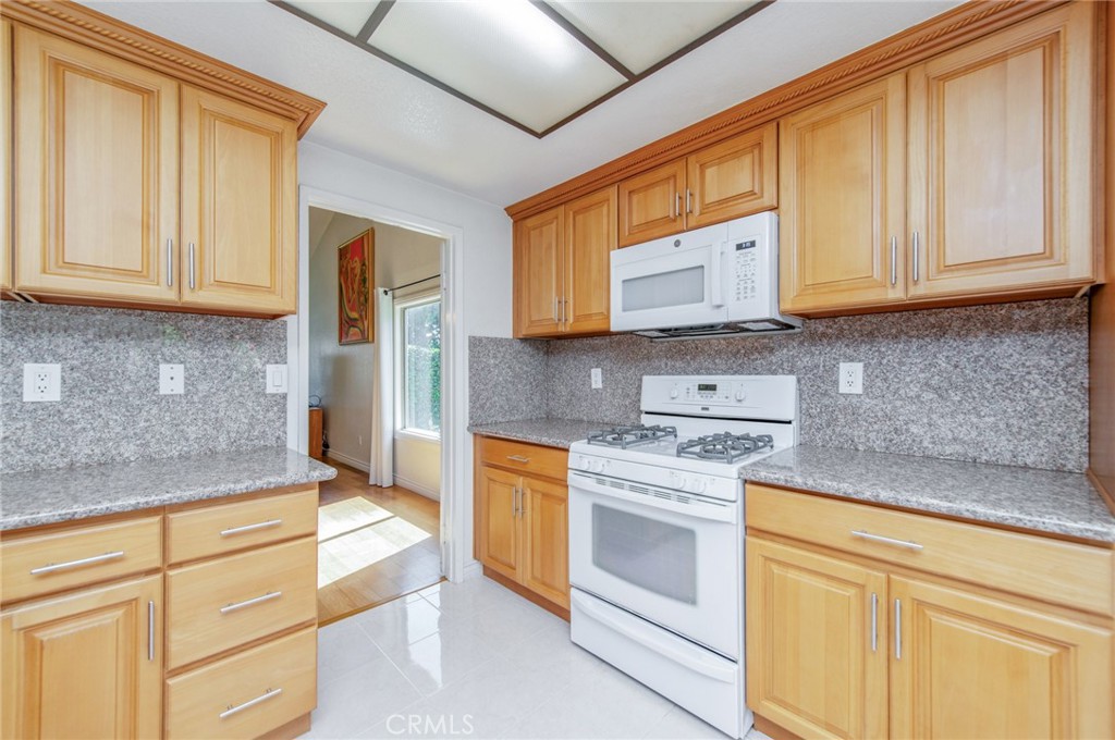 19621 Running Brand Circle Walnut, CA 91789 - Photo 13 of 40 a kitchen with stainless steel appliances granite countertop cabinets and a counter top space