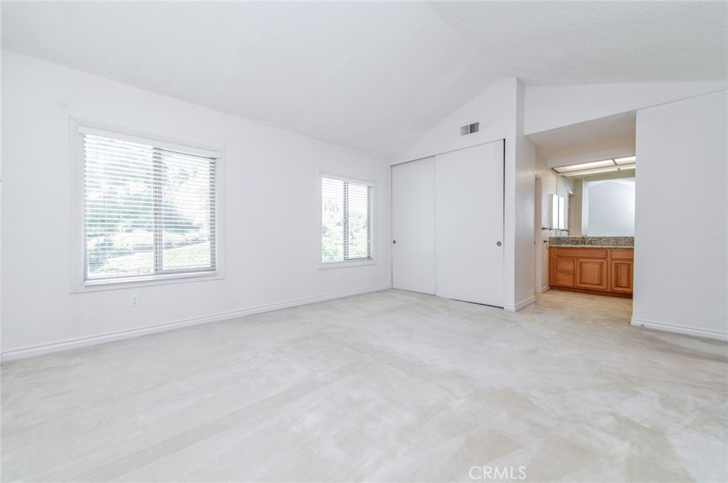 19621 Running Brand Circle Walnut, CA 91789 - Photo 24 of 40 an empty room with windows and bathroom view