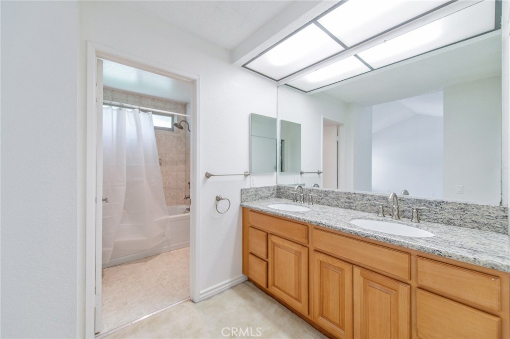 19621 Running Brand Circle Walnut, CA 91789 - Photo 30 of 40 a bathroom with a granite countertop sink mirror and double