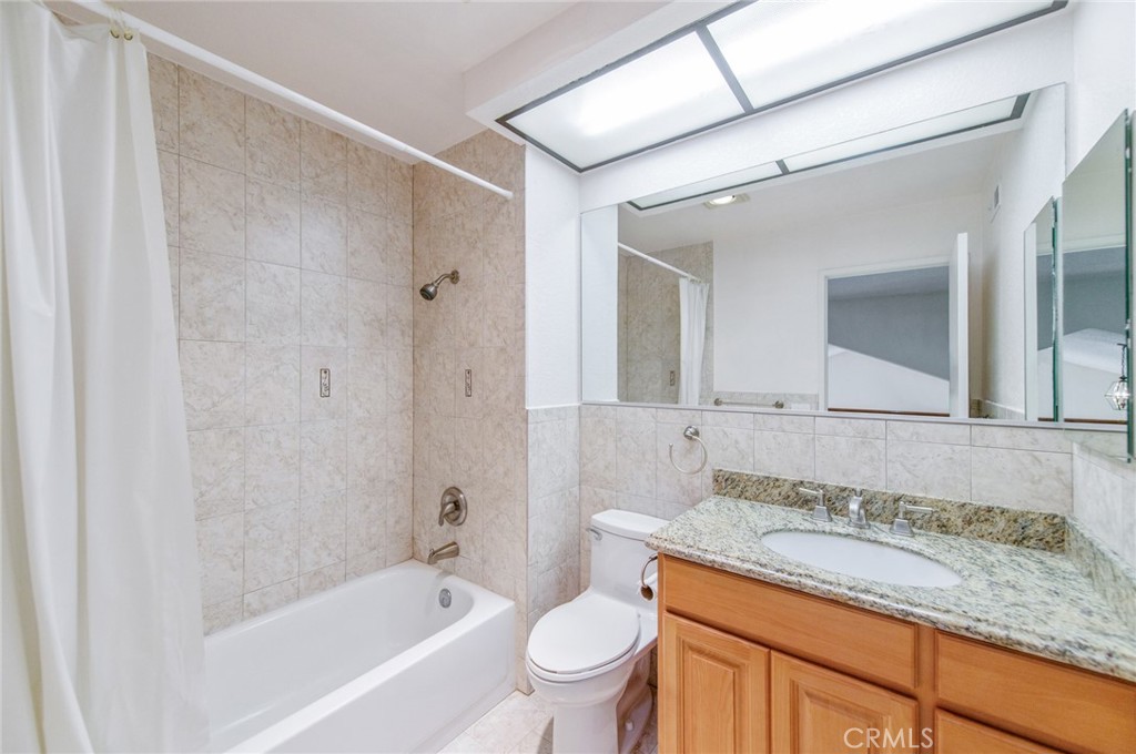 19621 Running Brand Circle Walnut, CA 91789 - Photo 31 of 40 a bathroom with a granite countertop sink a toilet and bathtub