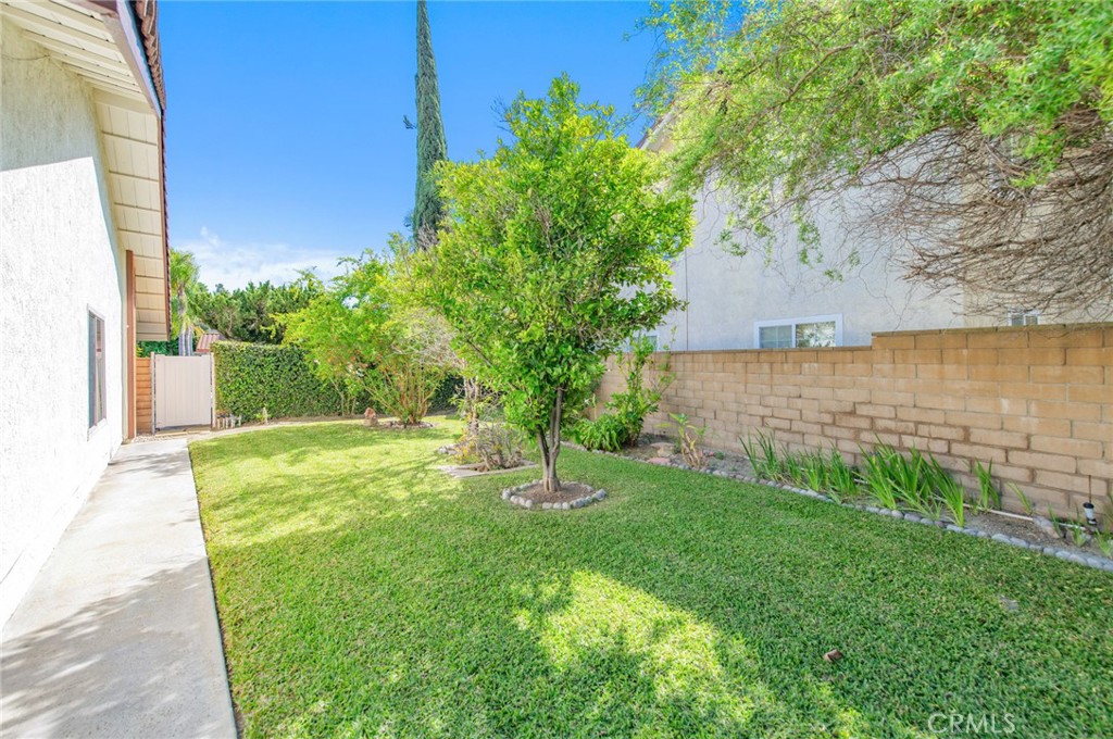 19621 Running Brand Circle Walnut, CA 91789 - Photo 35 of 40 a view of a backyard with brick wall