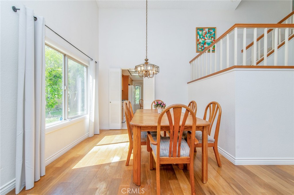 19621 Running Brand Circle Walnut, CA 91789 - Photo 5 of 40 a dining room with furniture a chandelier and wooden floor