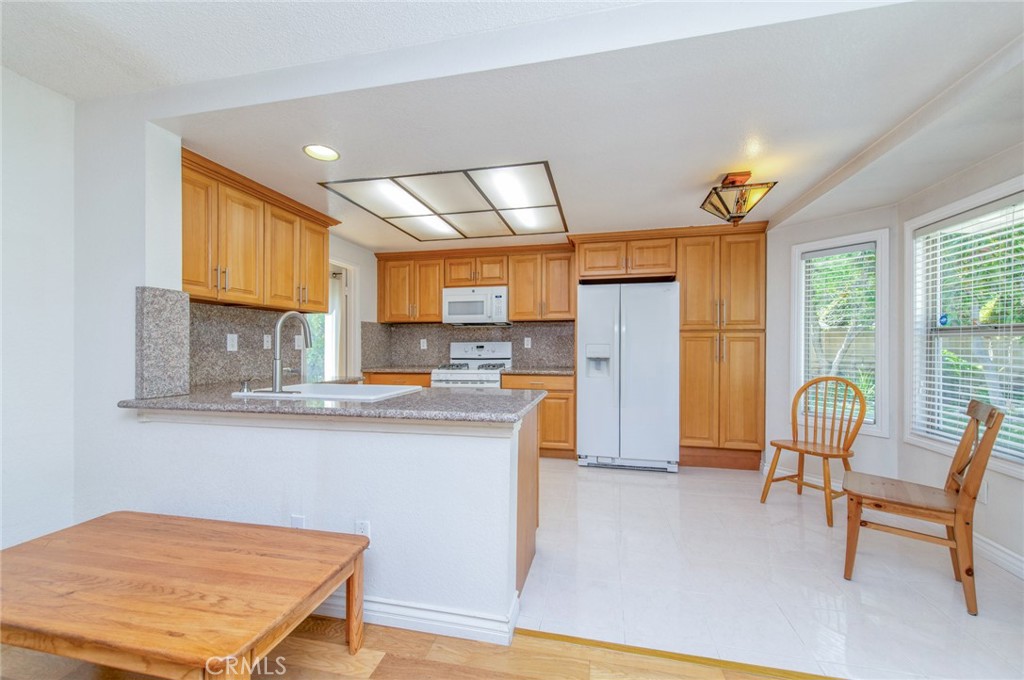 19621 Running Brand Circle Walnut, CA 91789 - Photo 9 of 40 a living room with stainless steel appliances kitchen island granite countertop furniture and a kitchen view