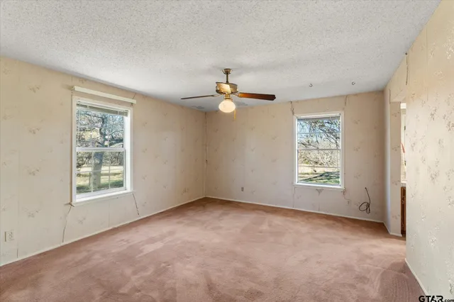 a view of a chandelier fan in a room