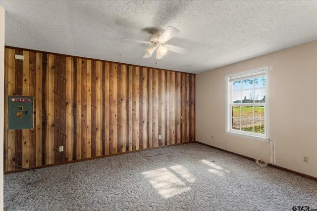 a utility room with cabinets dryer and washer