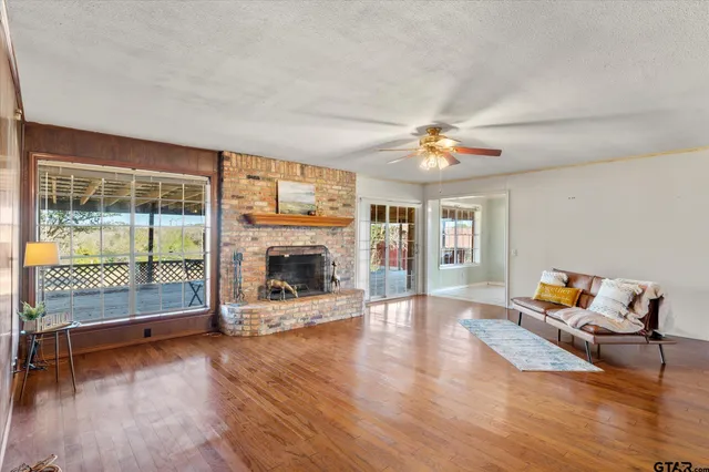 a living room with furniture and a fireplace