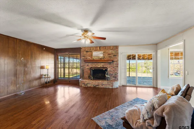 a living room with furniture fireplace and window