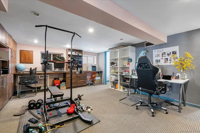 a view of a workspace with furniture