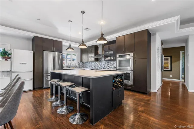 a large kitchen with a table and chairs