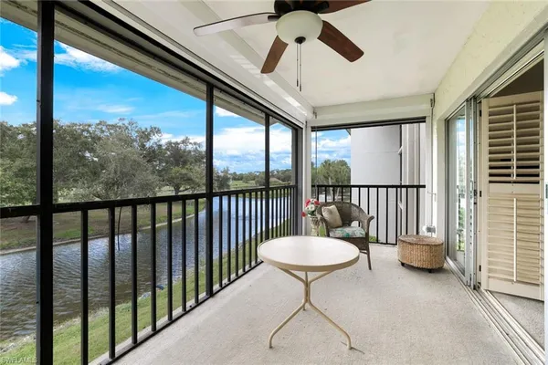 a view of a balcony with chairs