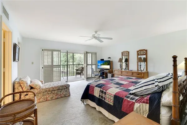 a bedroom with bed and windows