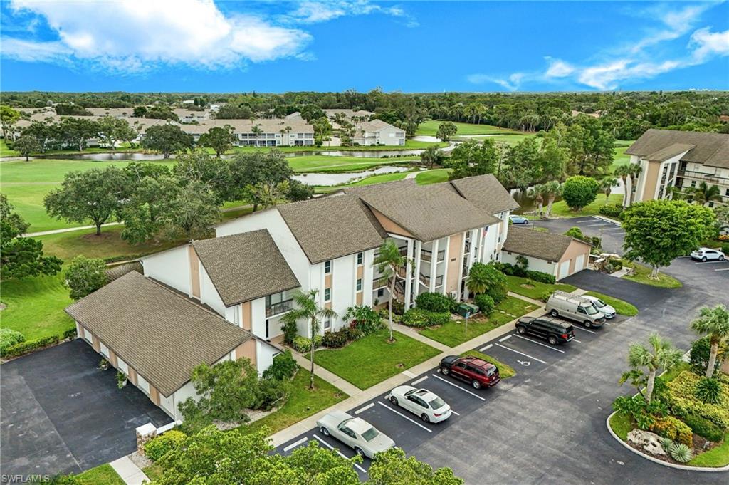1510 Imperial Golf Course Boulevard, Unit 111 Naples, FL 34110 - Photo 21 of 21 an aerial view of a house with garden space and outdoor space