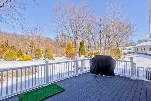 a view of a porch with wooden floor and fence
