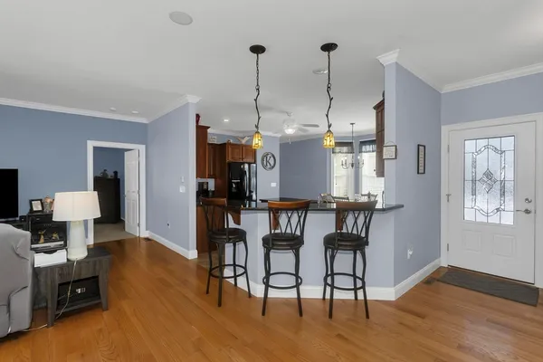 a view of a livingroom with furniture and a window