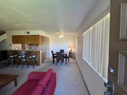 a view of a dining room with furniture window and outside view