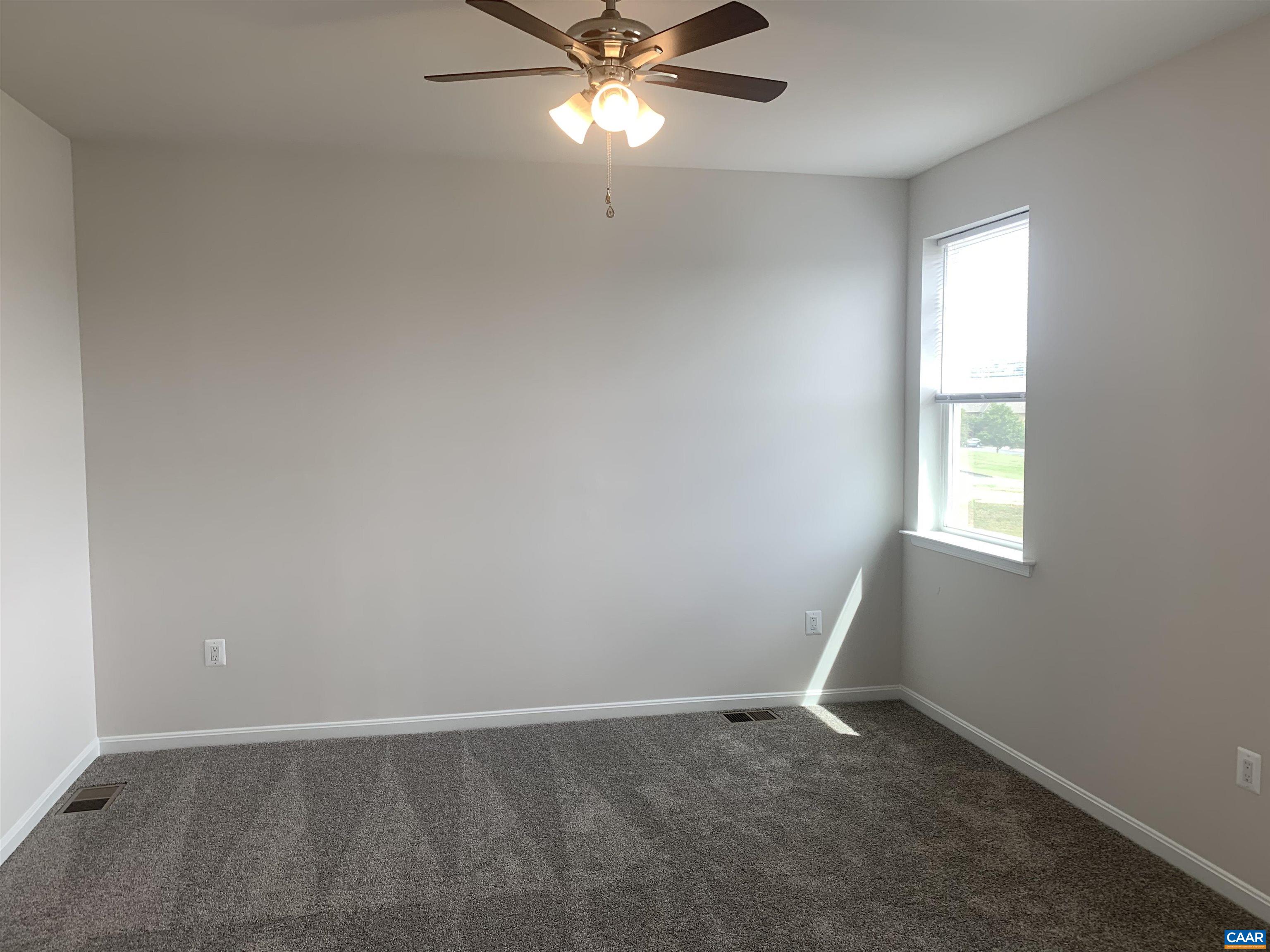 758 Round Hill Road Orange, VA 22960 - Photo 14 of 23 an empty room with a window and a fan