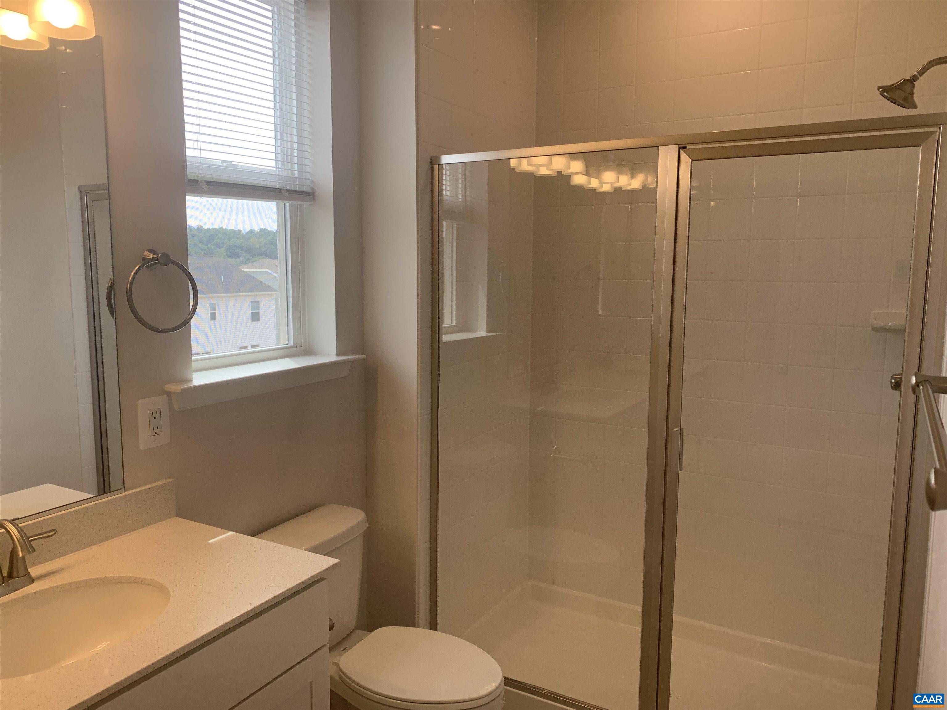 758 Round Hill Road Orange, VA 22960 - Photo 17 of 23 a bathroom with a sink a toilet and shower