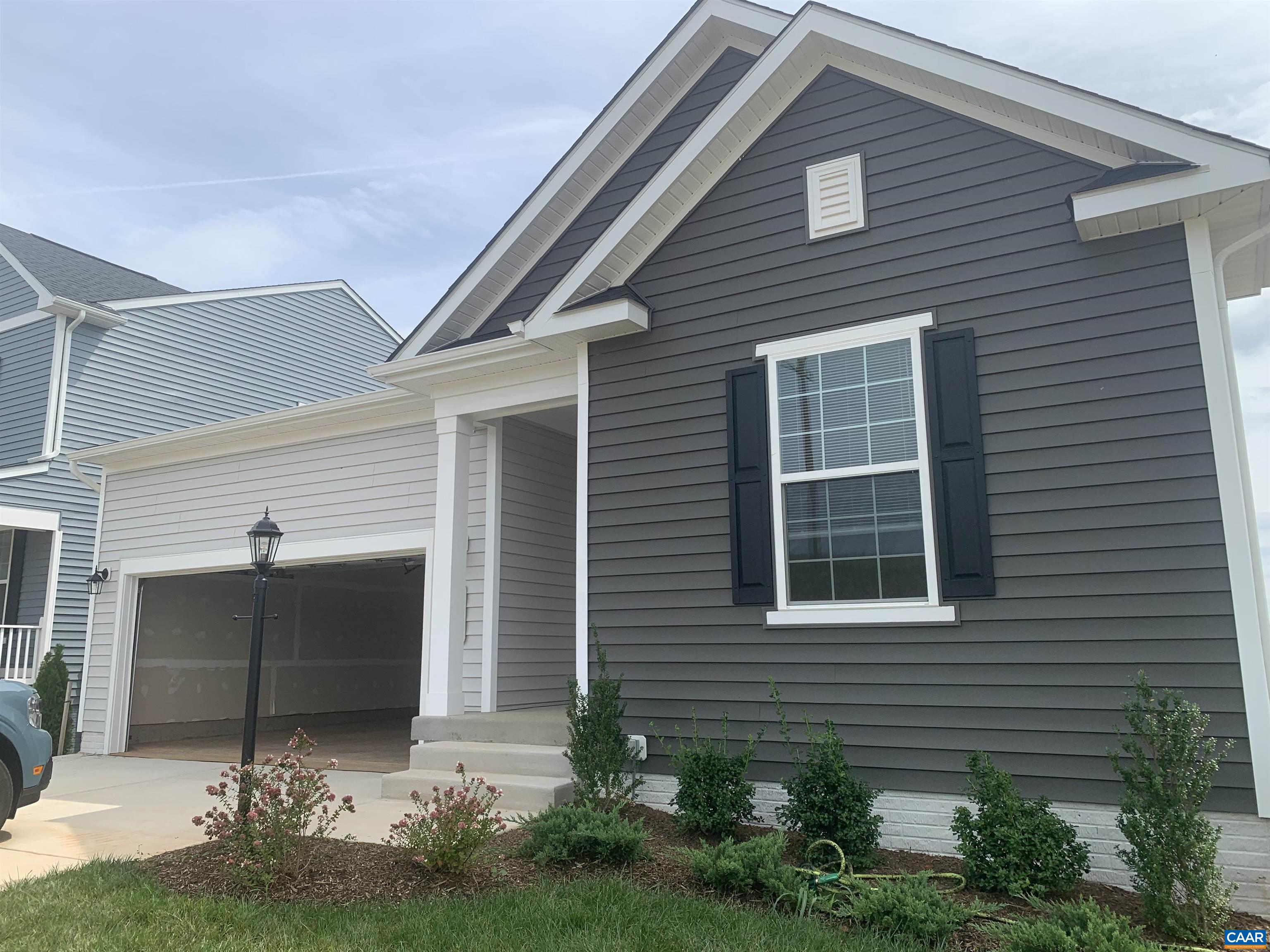 758 Round Hill Road Orange, VA 22960 - Photo 2 of 23 a front view of a house with garden