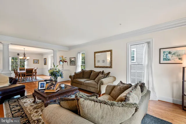 a large white kitchen with a large window