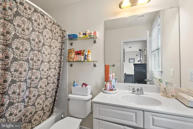 a large kitchen with a stove and a sink
