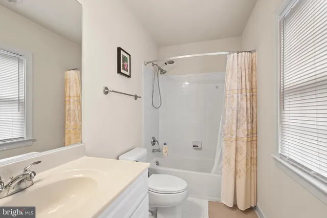 a bedroom with two beds and a couch