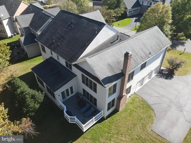a front view of a house with a yard table and chairs