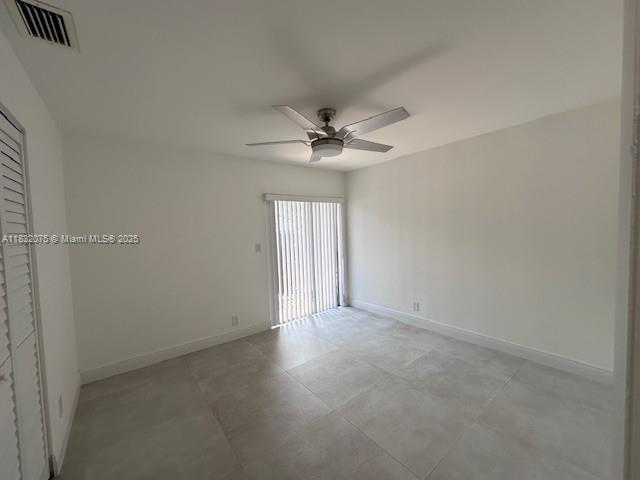 11572 Timbers Way, Unit 11572 Boca Raton, FL 33428 - Photo 11 of 22 an empty room with windows and fan