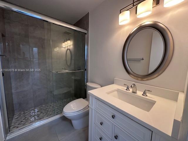 11572 Timbers Way, Unit 11572 Boca Raton, FL 33428 - Photo 12 of 22 a bathroom with a sink a toilet and a mirror