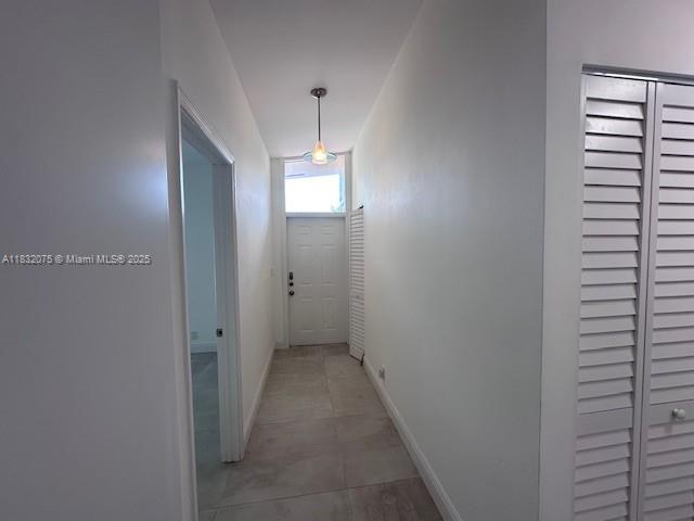 11572 Timbers Way, Unit 11572 Boca Raton, FL 33428 - Photo 14 of 22 a view of a hallway with closet