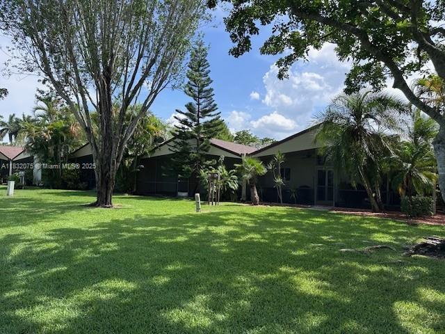 11572 Timbers Way, Unit 11572 Boca Raton, FL 33428 - Photo 22 of 22 a big yard with palm trees