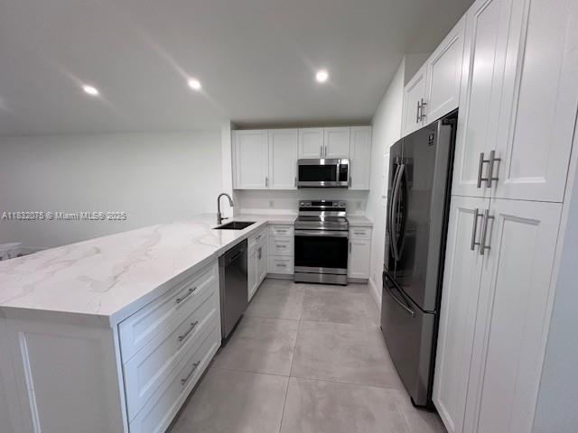 11572 Timbers Way, Unit 11572 Boca Raton, FL 33428 - Photo 4 of 22 a kitchen with a sink stainless steel appliances and cabinets