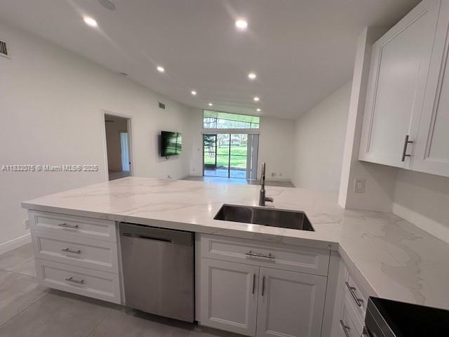 11572 Timbers Way, Unit 11572 Boca Raton, FL 33428 - Photo 5 of 22 a kitchen with granite countertop a sink and a window