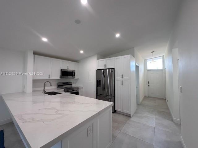 11572 Timbers Way, Unit 11572 Boca Raton, FL 33428 - Photo 6 of 22 a kitchen with stainless steel appliances a refrigerator sink and microwave