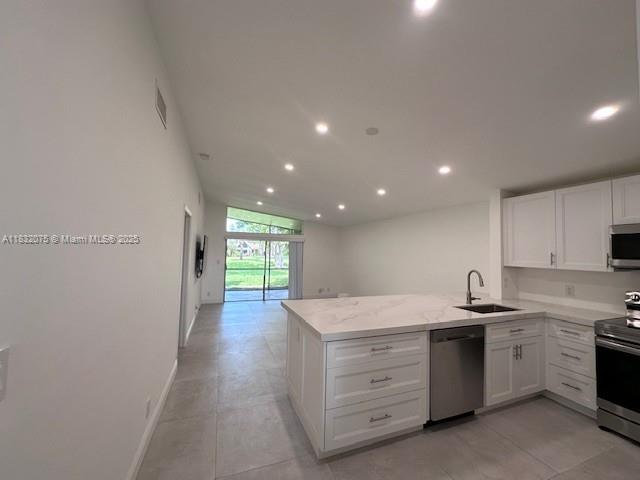 11572 Timbers Way, Unit 11572 Boca Raton, FL 33428 - Photo 7 of 22 a view of a kitchen with a sink stove and cabinets