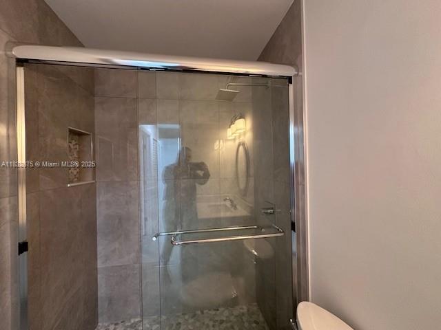 11572 Timbers Way, Unit 11572 Boca Raton, FL 33428 - Photo 10 of 22 a bathroom with a glass shower door