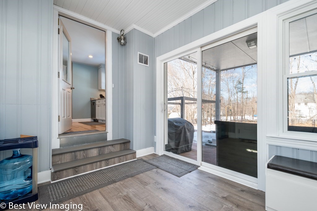 118 Goldthwaite Road Northbridge, MA 01588 - Photo 13 of 24 a view of front door and bedroom with wooden floor