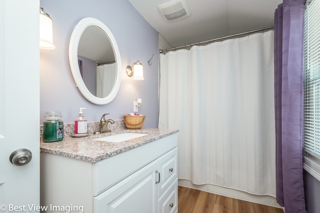 118 Goldthwaite Road Northbridge, MA 01588 - Photo 22 of 24 a bathroom with a granite countertop sink and a mirror
