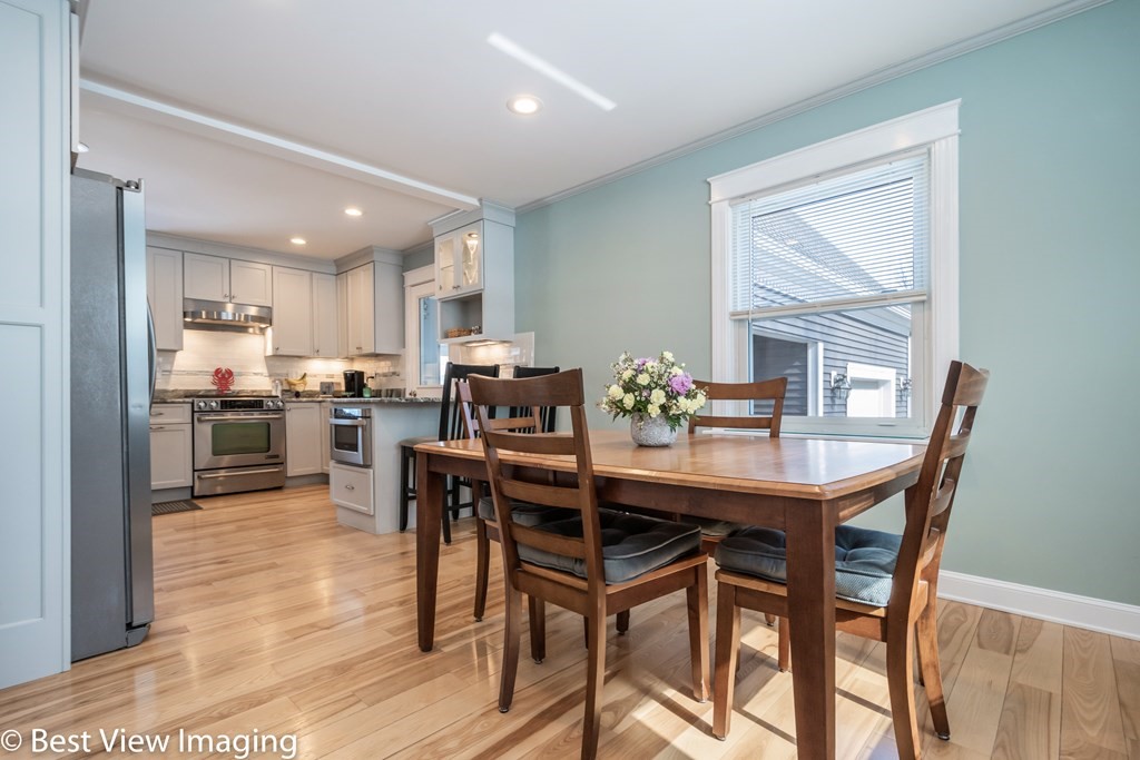 118 Goldthwaite Road Northbridge, MA 01588 - Photo 7 of 24 a dining area with stainless steel appliances kitchen island granite countertop a dining table chairs and a refrigerator