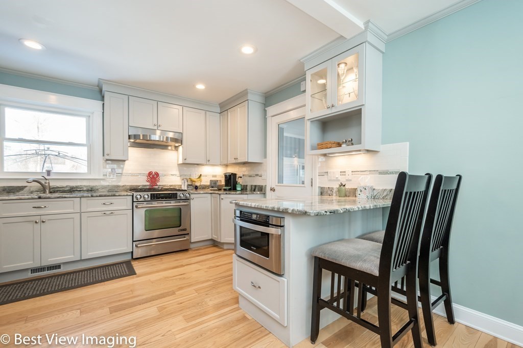 118 Goldthwaite Road Northbridge, MA 01588 - Photo 10 of 24 a kitchen with a white cabinets and appliances