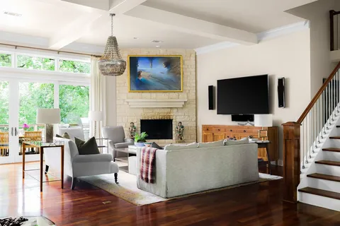 a living room with furniture fireplace and flat screen tv
