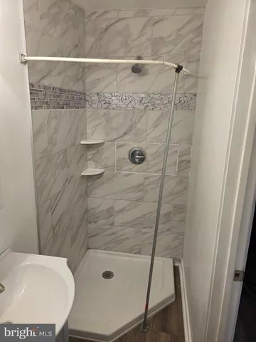 a bathroom with a shower and toilet
