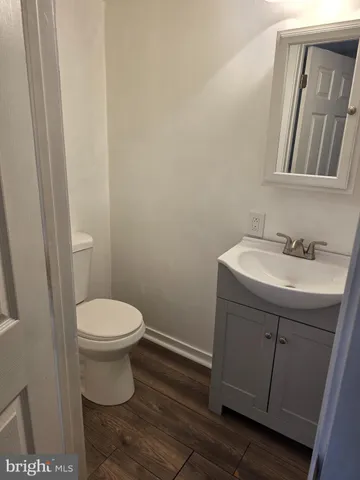 a bathroom with a sink toilet and vanity