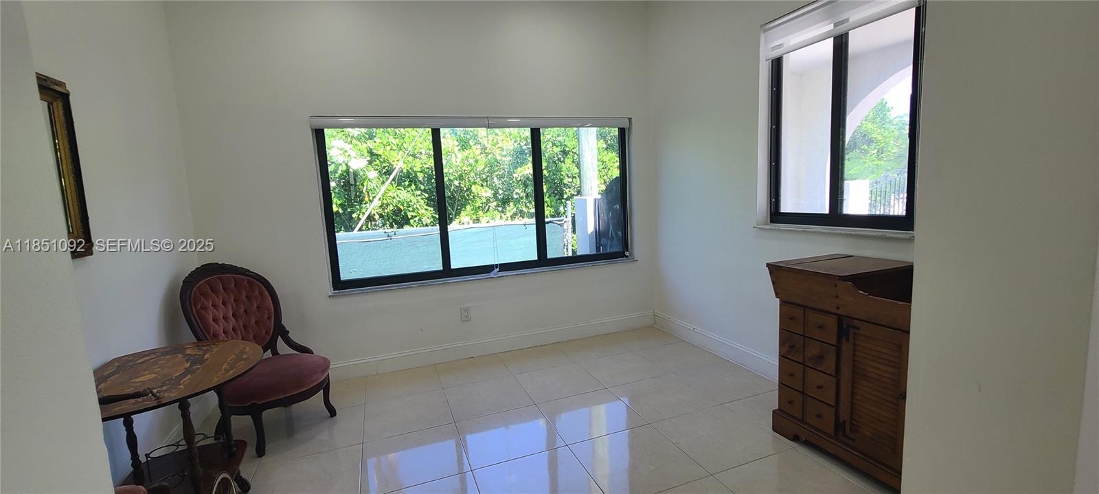 1721 Southwest 24th Terrace Miami, FL 33145 - Photo 9 of 80 a room with a chair and a window