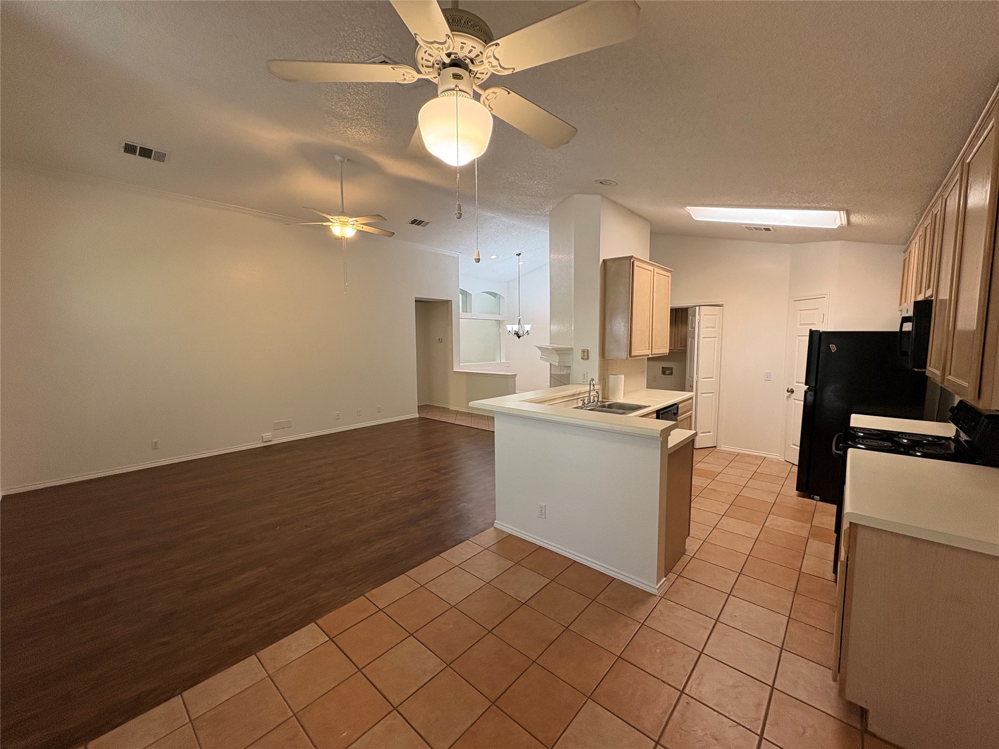 Kitchen includes gas range, microwave, refrigerator, dishwasher, and walk in pantry