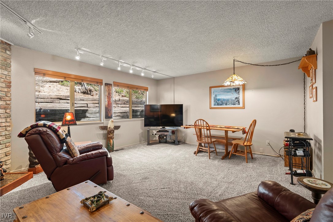 321 Ski Way, Unit 24 Incline Village, NV 89451 - Photo 4 of 31 a living room with furniture and a flat screen tv