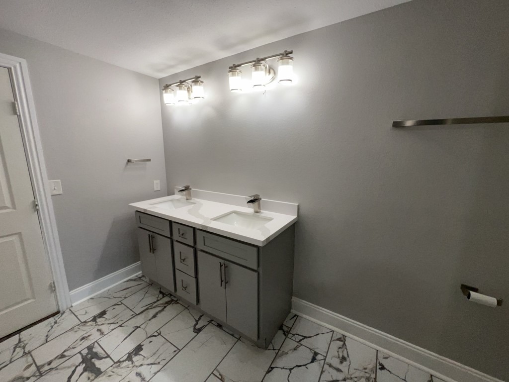 401 Walton Street Houston, TX 77009 - Photo 17 of 27 a bathroom with a sink toilet and vanity