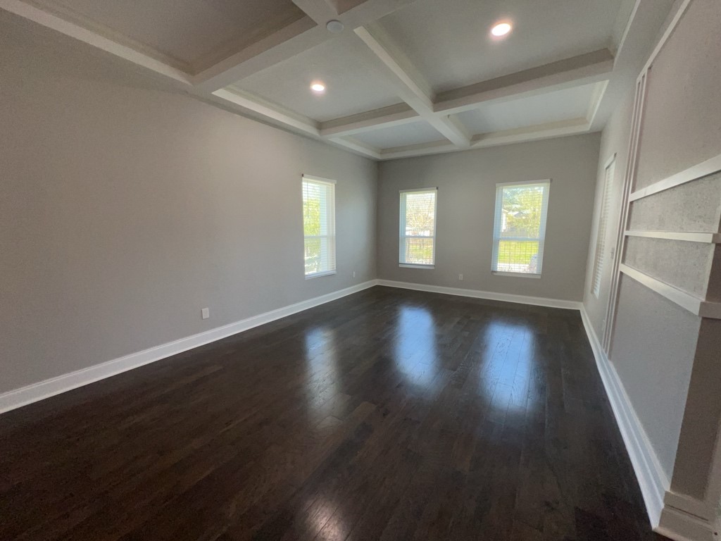 401 Walton Street Houston, TX 77009 - Photo 5 of 27 an empty room with wooden floor and windows
