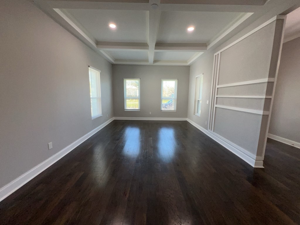 401 Walton Street Houston, TX 77009 - Photo 8 of 27 an empty room with wooden floor and windows