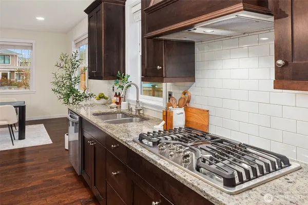 a kitchen with a stove and a sink