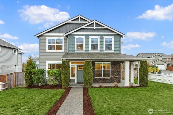 a front large house with a yard